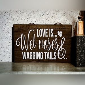 Love is wet noses and wagging tails wood sign.
